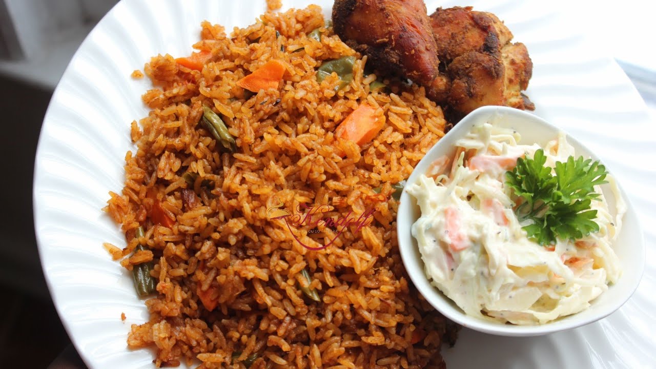 Jollof Rice, salad, and chicken